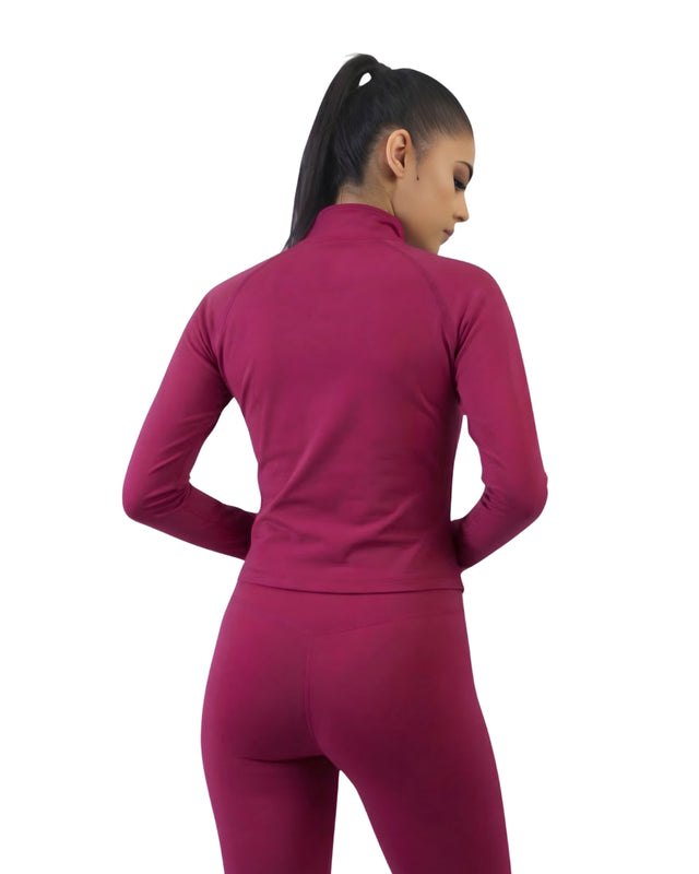 Person wearing a magenta athletic outfit on a white background