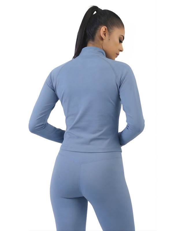 Woman wearing a blue athletic outfit on a white background