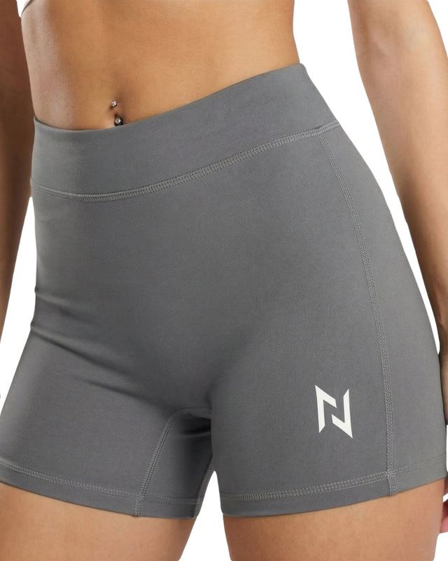 Gray athletic shorts with a logo on a white background