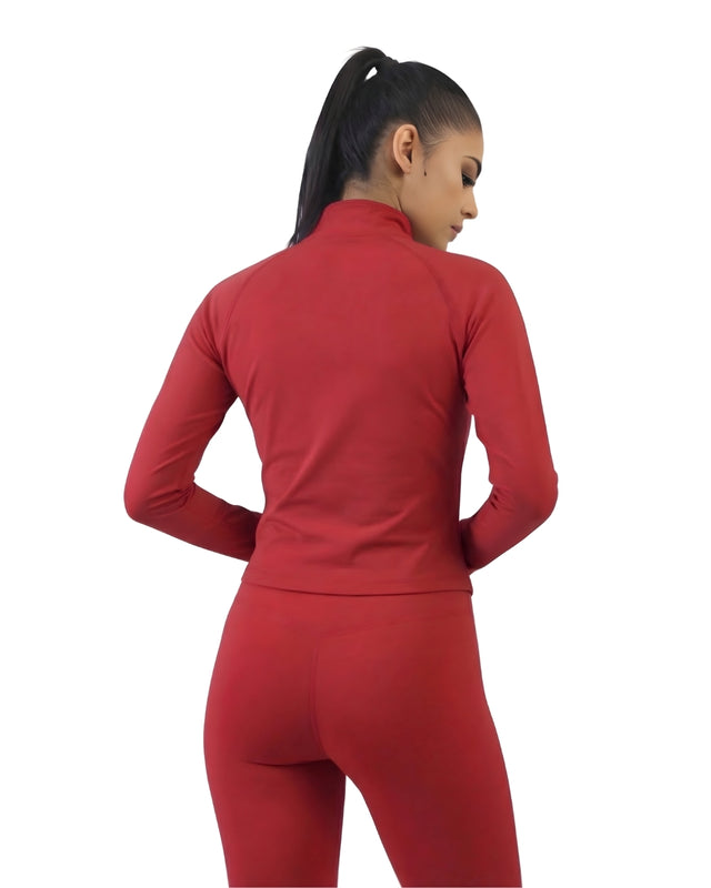 Person wearing a red athletic outfit on a white background