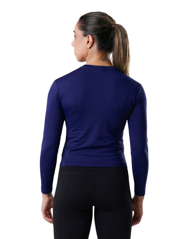 Person wearing a blue long-sleeve athletic shirt on a white background