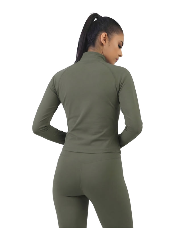 Person wearing a green athletic outfit on a white background