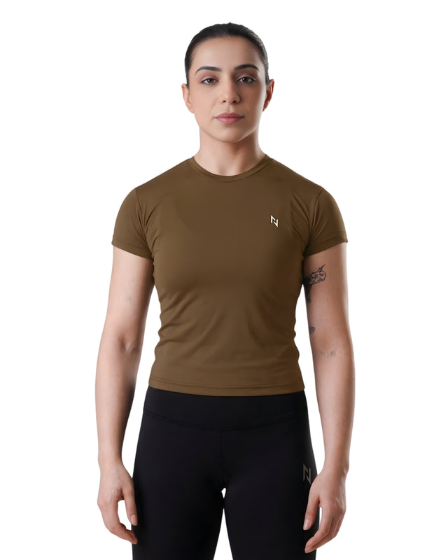 Woman wearing a brown athletic shirt and black leggings with a logo on a white background
