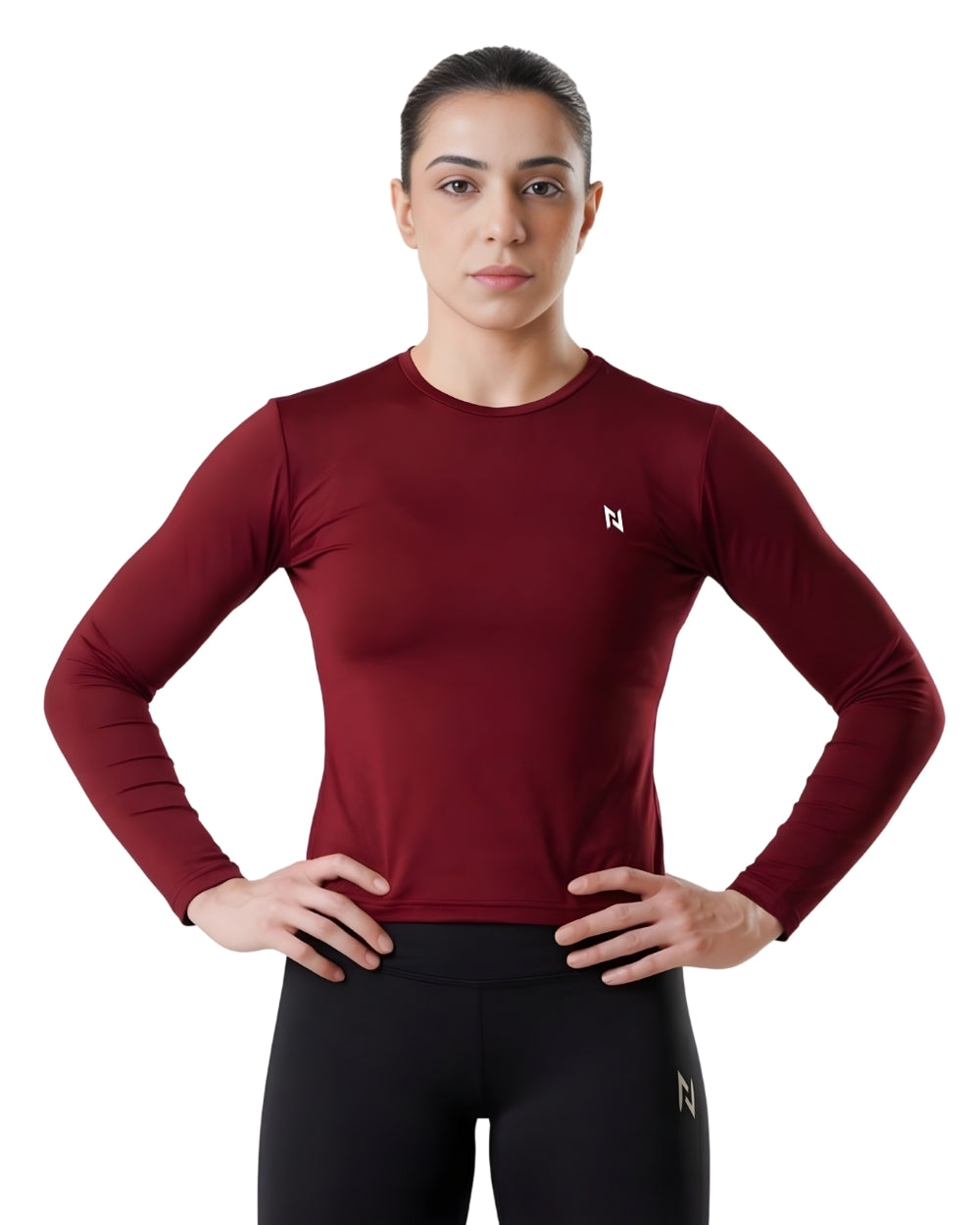 Person wearing a maroon long-sleeve athletic shirt with a logo on a white background