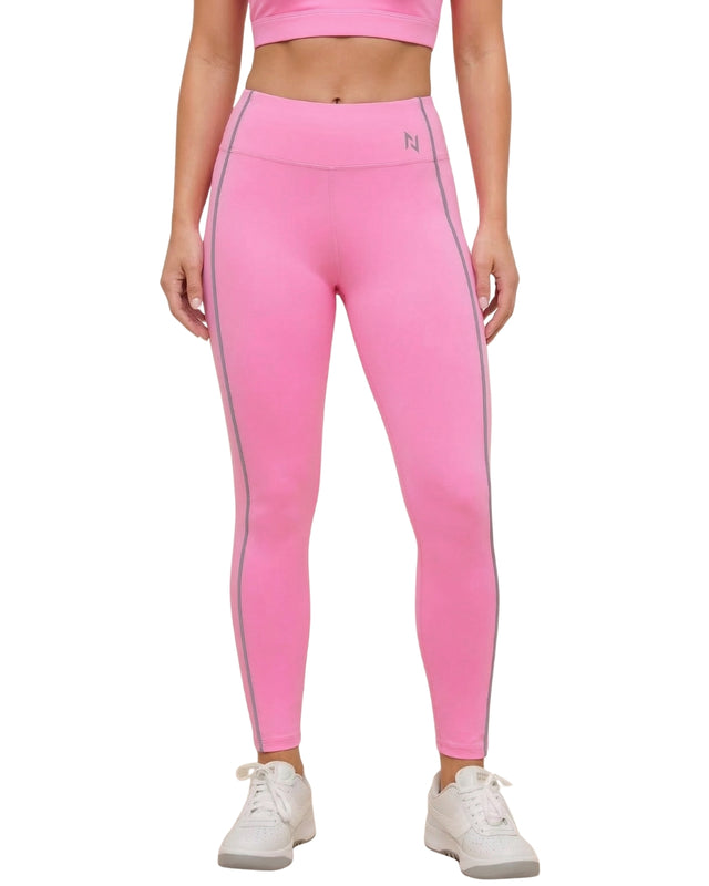 Person wearing pink leggings with a white stripe on a white background