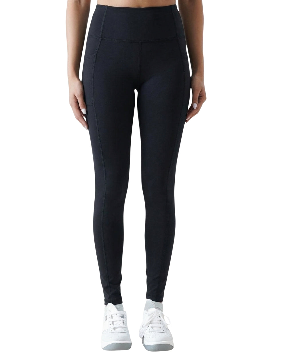 Person wearing black leggings with white sneakers on a white background