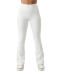 White pants worn by a person on a white background