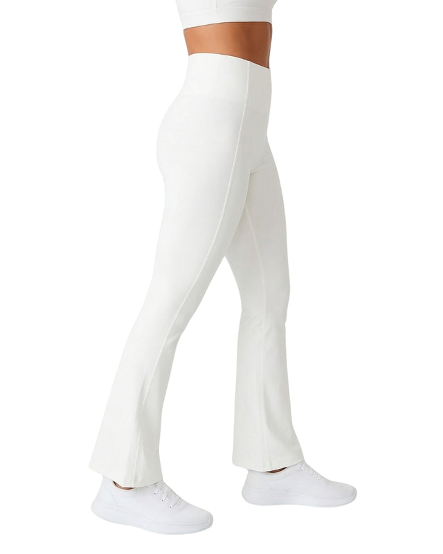 White leggings worn by a person on a white background