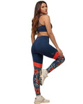 Woman wearing navy and red patterned leggings on a white background