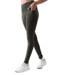 Person wearing dark gray leggings on a white background