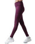 Purple leggings worn by a person on a white background