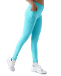Turquoise leggings worn by a person on a white background