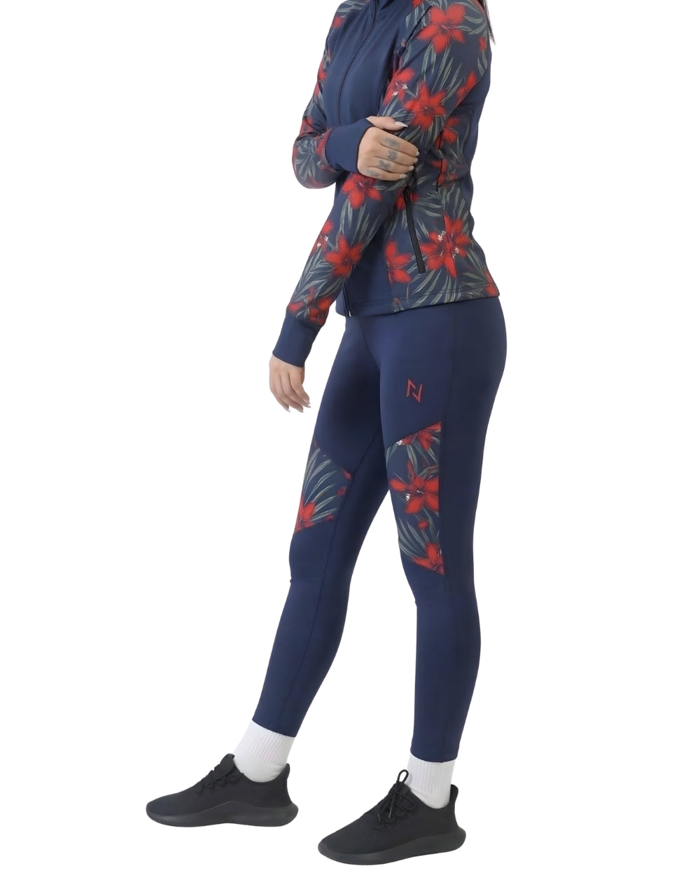 Person wearing a navy athletic outfit with red floral patterns on a white background