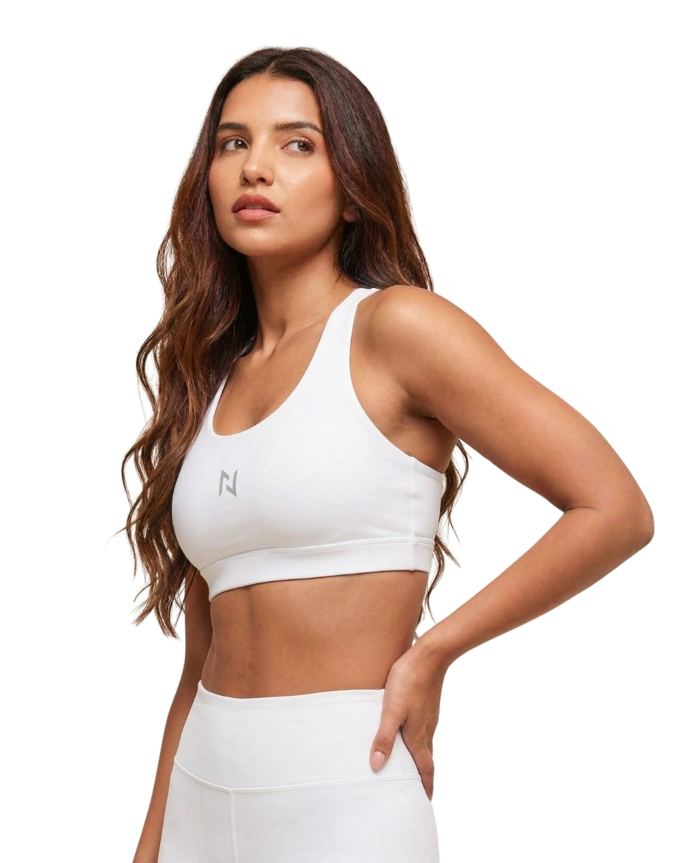 Woman wearing a white sports bra with a brand logo on a white background