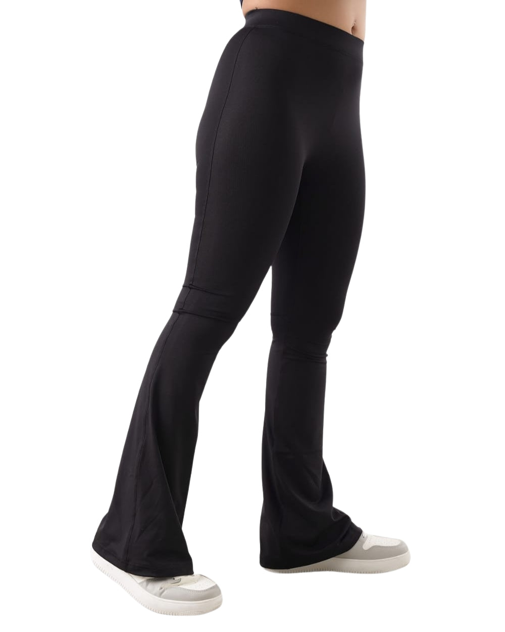 Black flared pants worn by a person on a white background