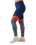 Navy leggings with red and white floral pattern worn by a person on a white background