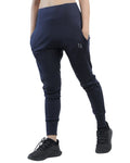 Navy blue jogger pants worn by a person on a white background
