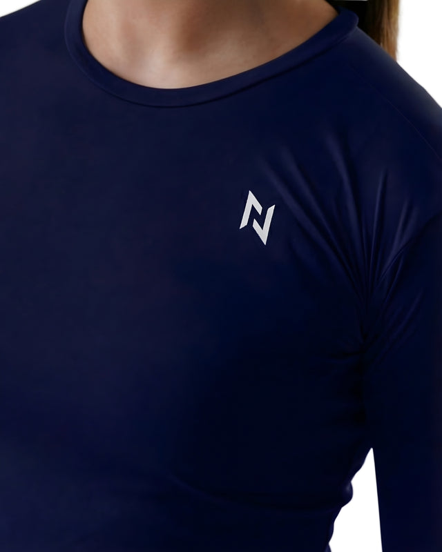 Navy long-sleeve shirt with a logo on the chest against a neutral background