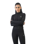 Woman wearing a black athletic outfit with a logo on a white background