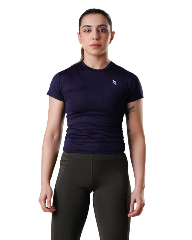 Woman wearing a dark blue athletic shirt with a logo on a white background