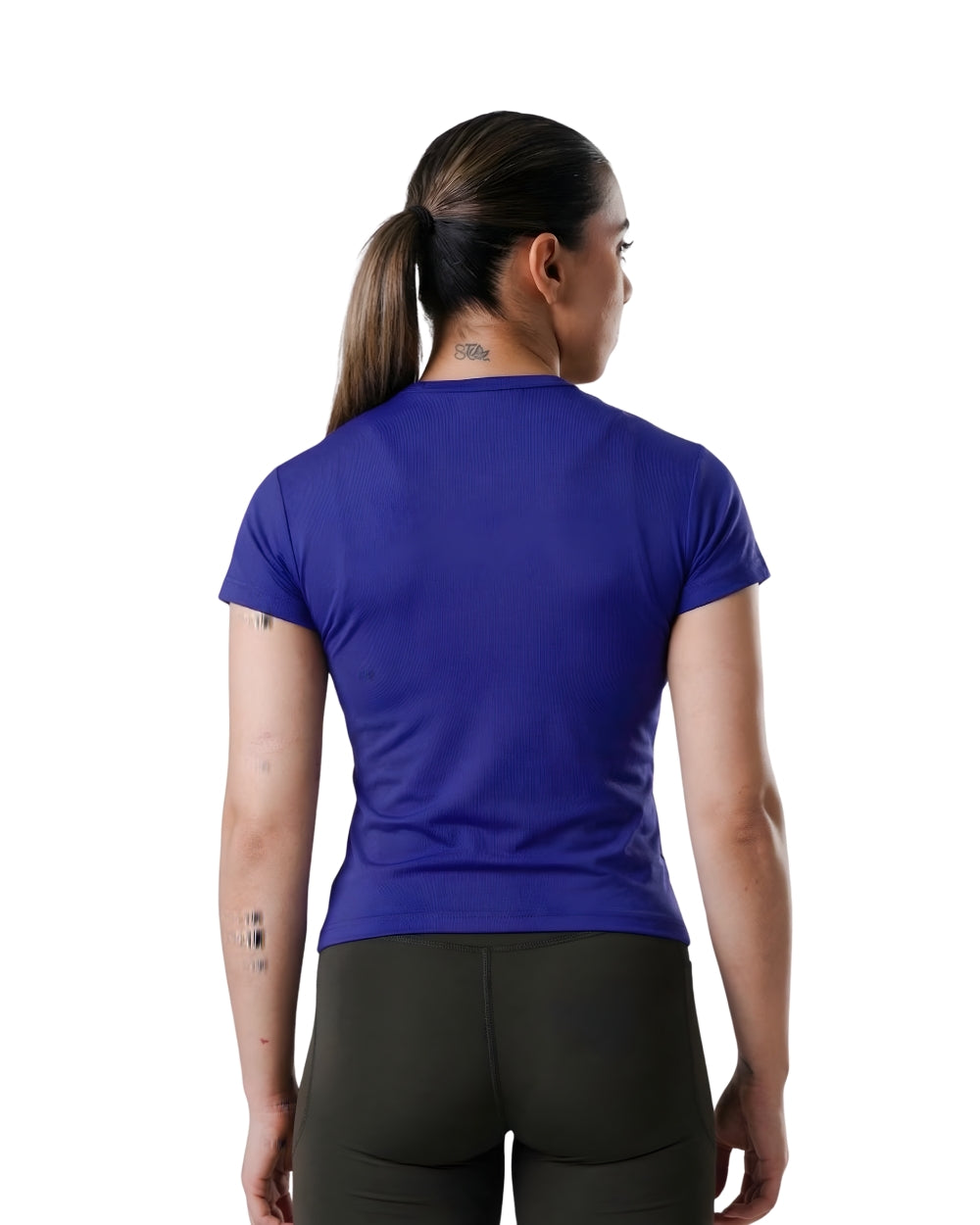 Person wearing a blue athletic shirt and black leggings on a white background