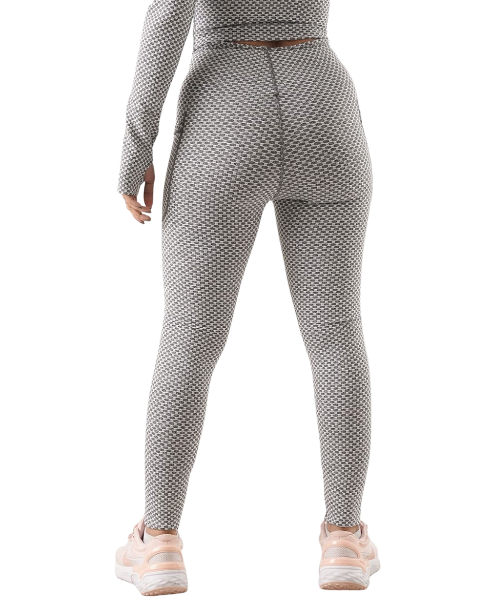 Person wearing a gray patterned outfit on a white background