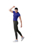 Woman wearing a blue athletic shirt and black leggings on a white background