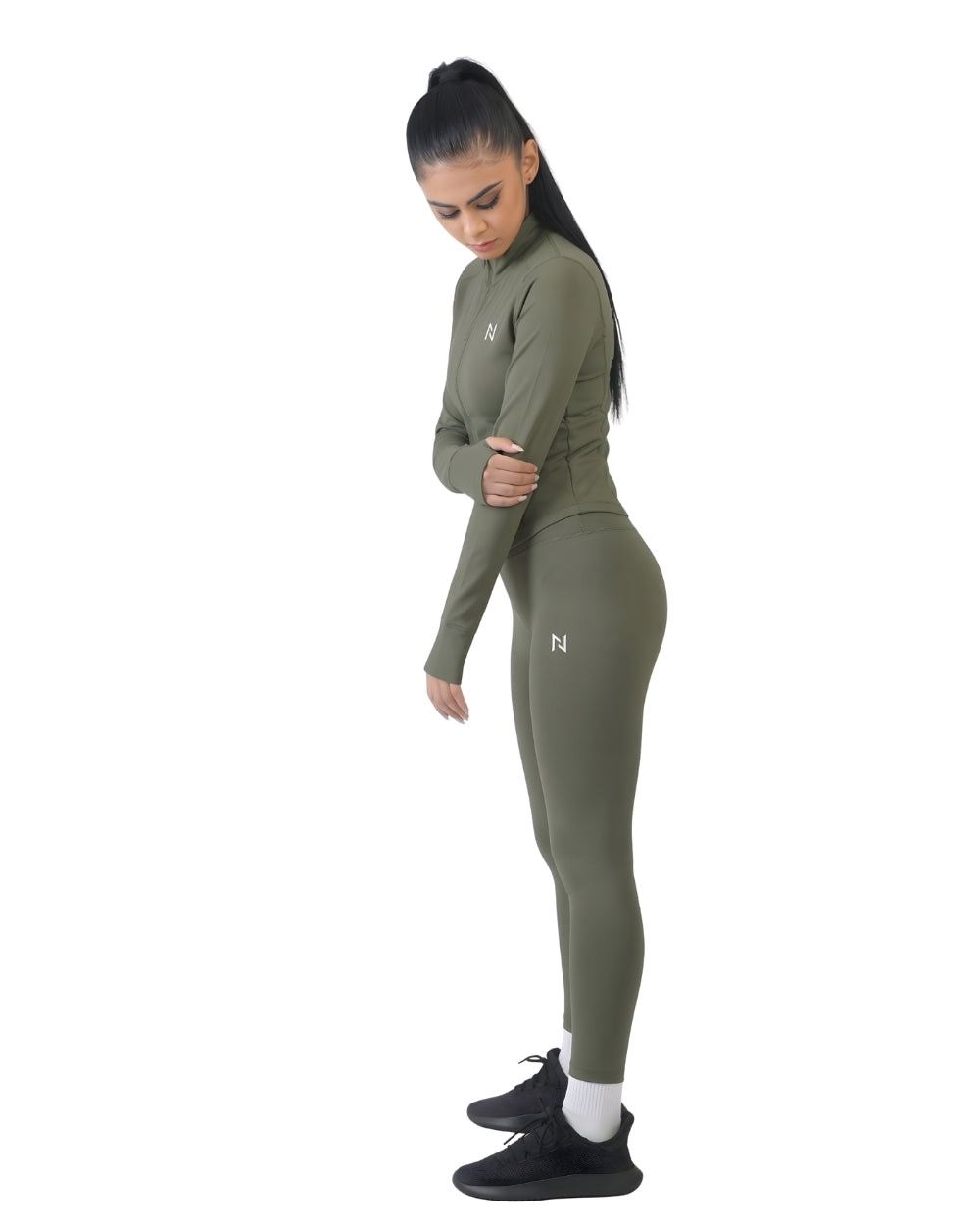 Woman wearing a green athletic outfit with a logo on a white background