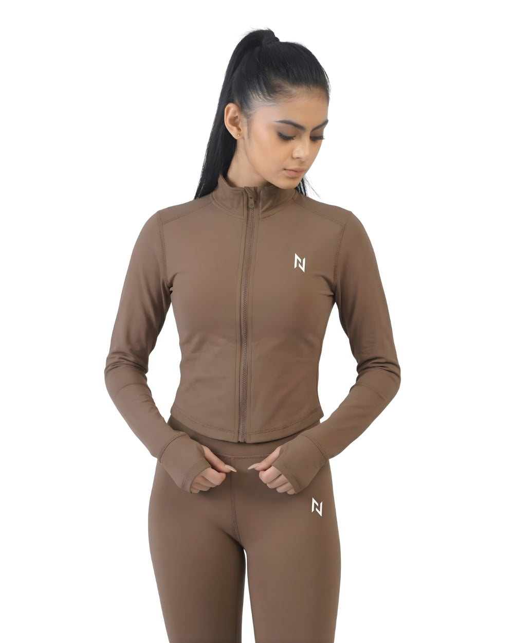 Woman wearing a brown athletic outfit with a logo on a white background