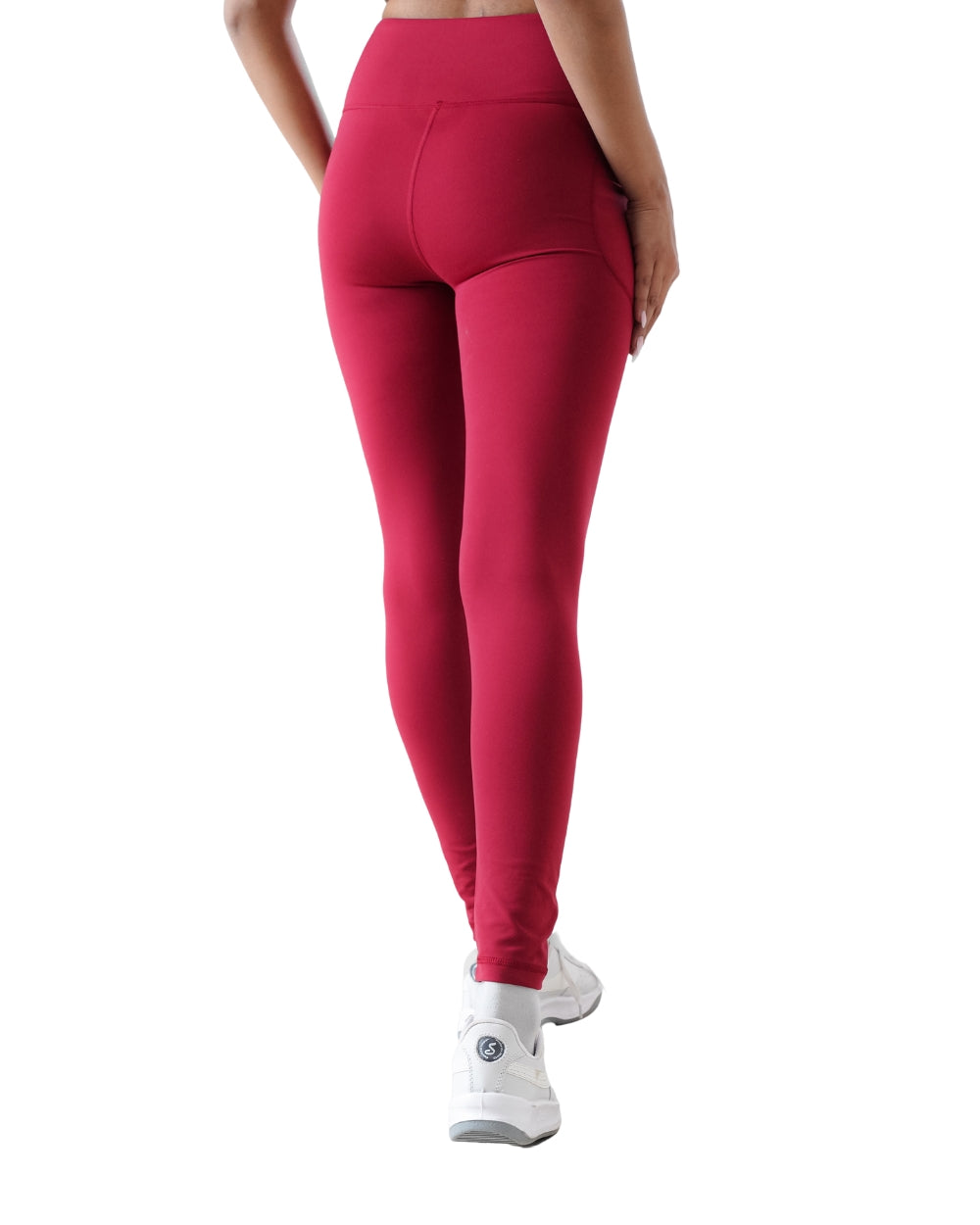 Red leggings worn by a person on a white background