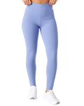 Light blue leggings worn by a person on a white background