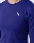 Blue long-sleeve shirt with a white logo on a light gray background