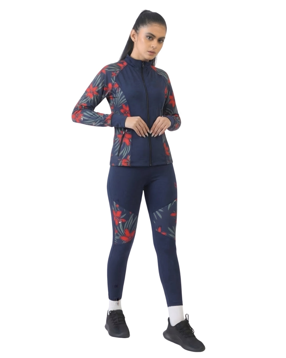 Woman wearing a navy athletic outfit with red floral patterns on a white background