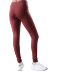 Maroon leggings worn by a person on a white background