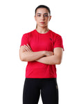 Person wearing a red athletic shirt and black leggings on a white background