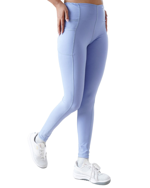 Light blue leggings worn by a person on a white background