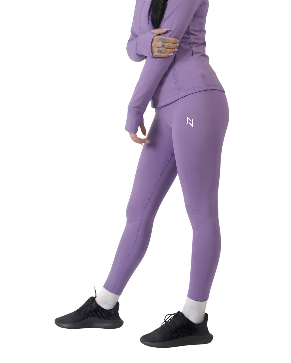 Person wearing a purple athletic outfit with a visible brand logo on a white background