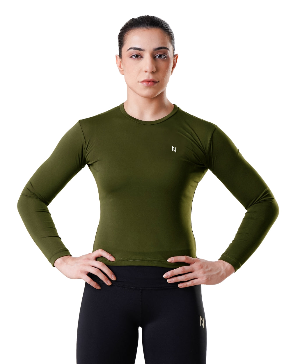 Woman wearing a green long-sleeve athletic shirt with a brand logo on a white background