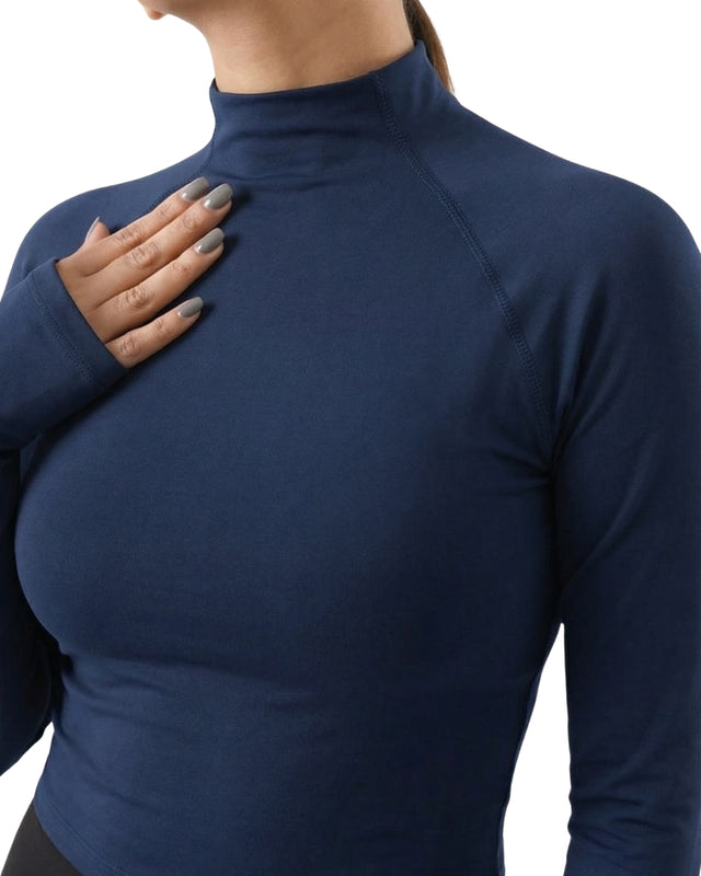 Navy blue long-sleeve top worn by a person on a white background