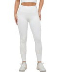 Person wearing white leggings and a white top on a white background