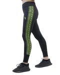 Black leggings with green snake pattern on a white background