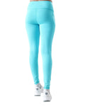 Turquoise leggings worn by a person on a white background
