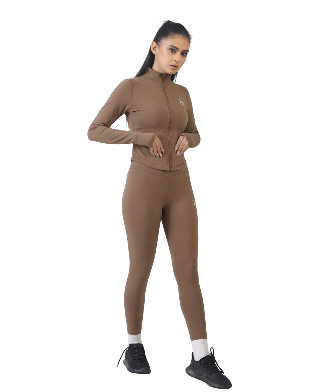 Woman wearing a brown athletic outfit on a white background